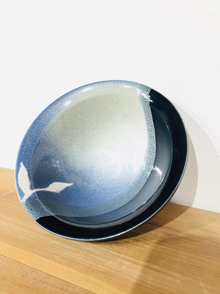 Bowl with layered glazes ranging from very dark to very light blue