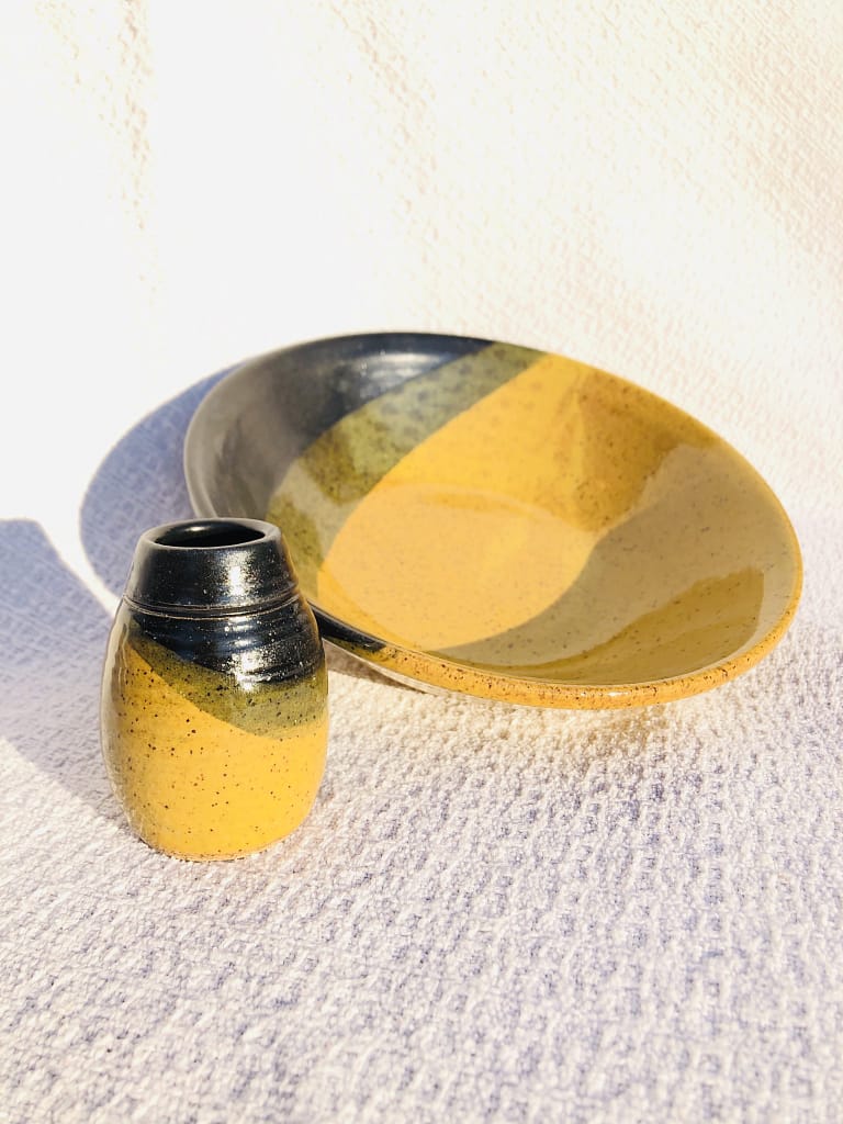 A small yellow vase and bowl in gold and temmoku glazes