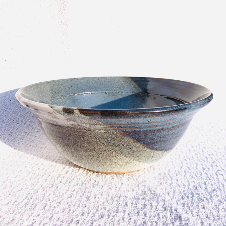 Detailed view of the glaze on a bowl in blue and rutile blue