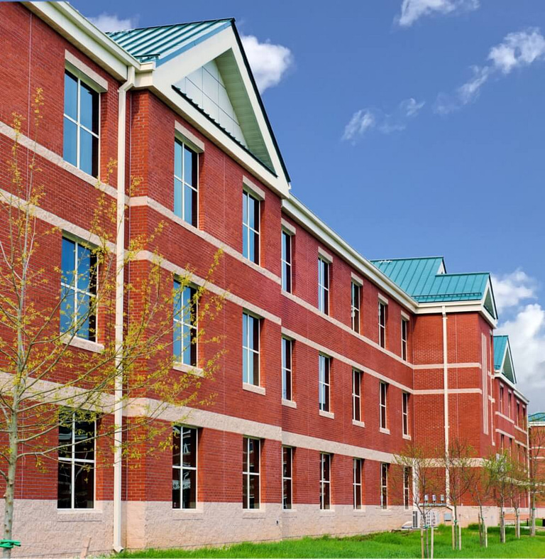 exterior view military housing red brick and imposing collegiate aesthetic, housing in Yorktown VA